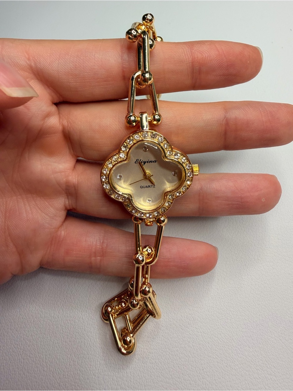 Gold-Tone Clover Quartz Watch with White Dial and Crystal Accents - Picture 3 of 15